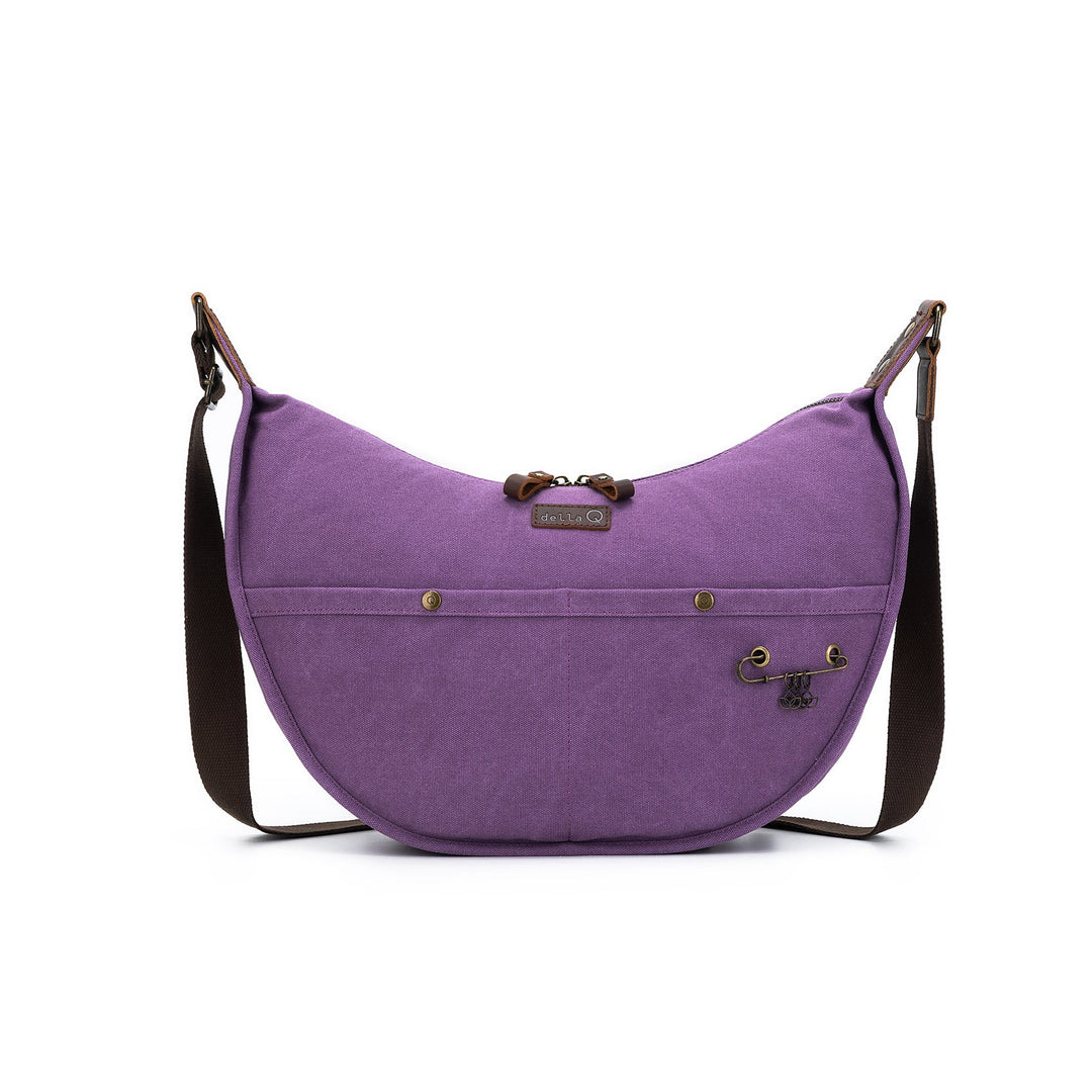 Purple shoulder bag with brown strap on a white background