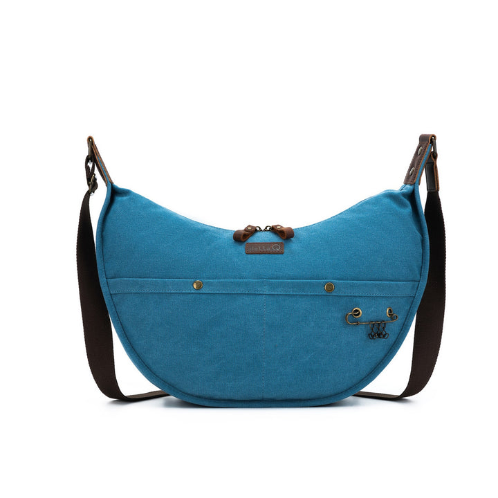 Blue bag with a black strap on a white background