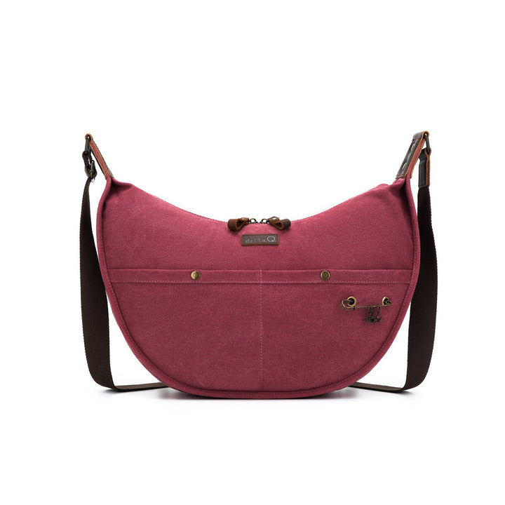 Pink shoulder bag with a strap on a white background