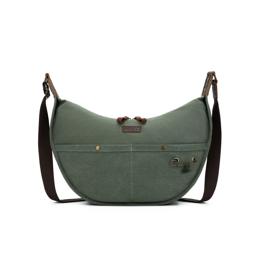 Green shoulder bag with brown straps on a white background