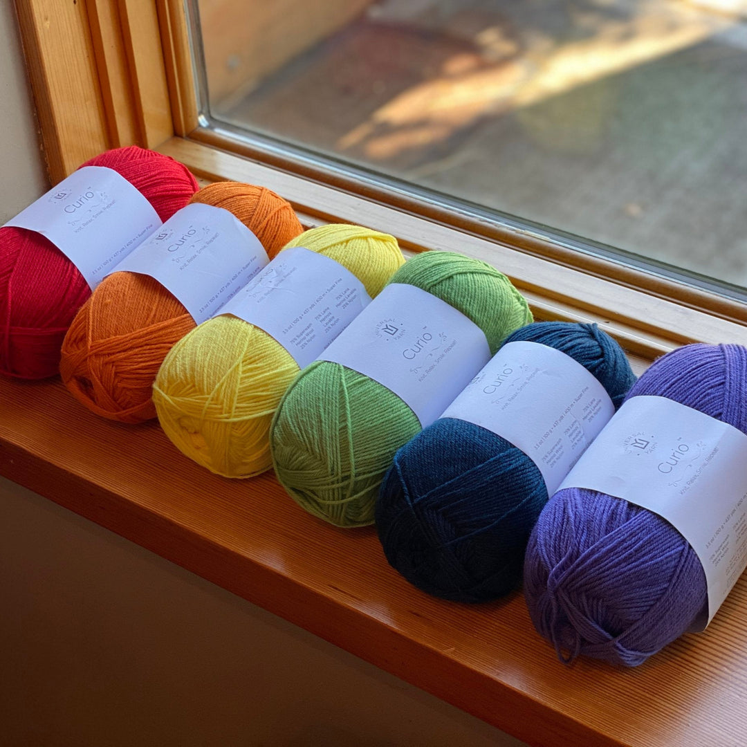 A row of skeins of Uni Merino yarn